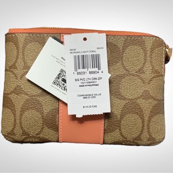 Coach Corner Zip Wristlet in Signature
Canvas Tan with Coral Stripe - Picture 3 of 5